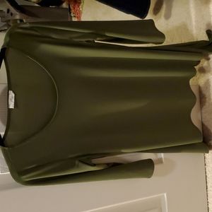 3/4 sleeve dress shirt. Longer on sides.